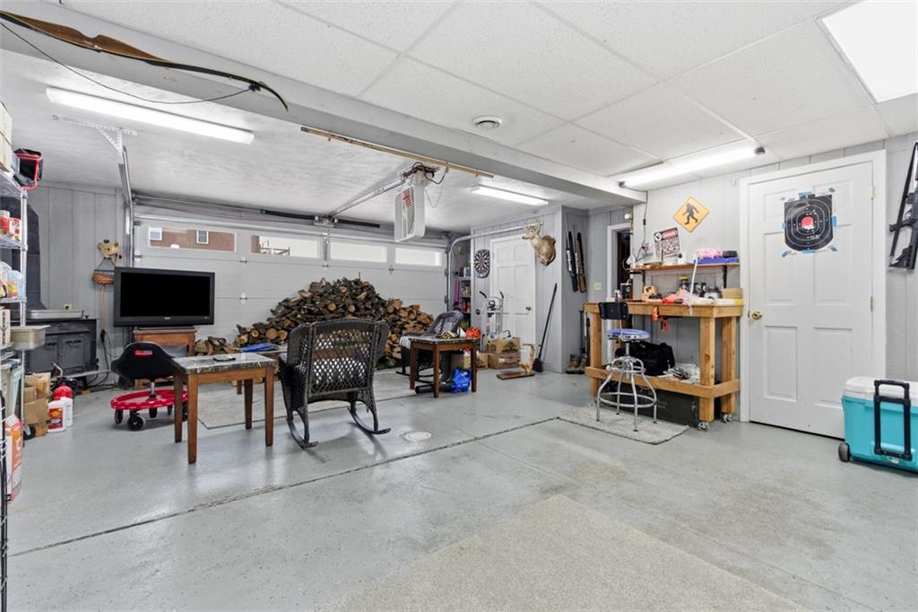 2976 Henderson Road Washington, PA 15301 - Photo 21 of 50 a garage with furniture and a flat screen tv