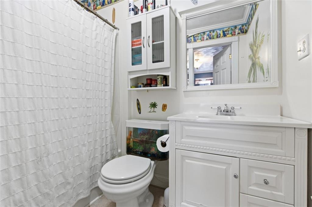 2976 Henderson Road Washington, PA 15301 - Photo 29 of 50 a bathroom with a toilet sink and mirror