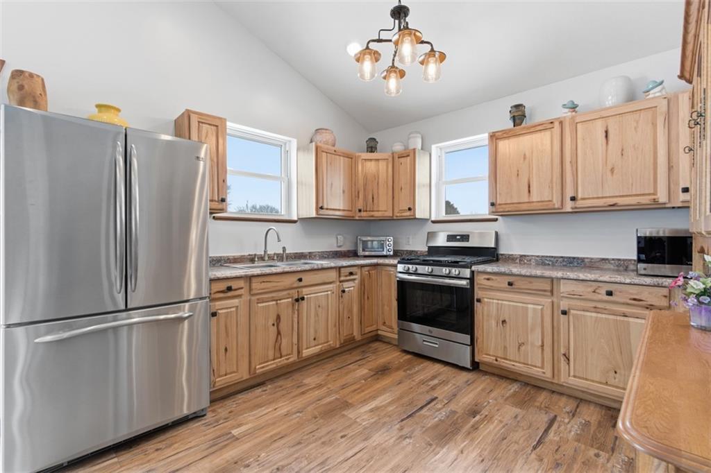 2976 Henderson Road Washington, PA 15301 - Photo 39 of 50 a kitchen with stainless steel appliances granite countertop a refrigerator a stove a sink and white cabinets