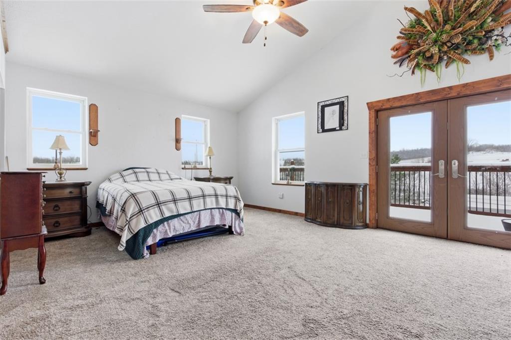 2976 Henderson Road Washington, PA 15301 - Photo 42 of 50 a spacious bedroom with a bed a couch and a chandelier