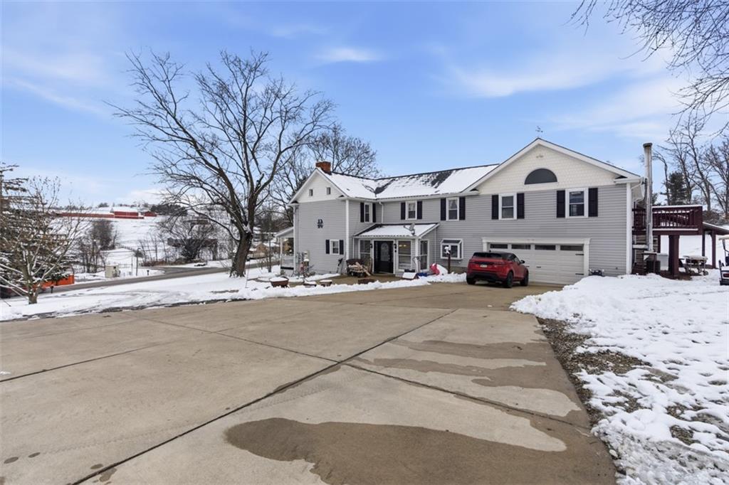 2976 Henderson Road Washington, PA 15301 - Photo 5 of 50 a front view of a house with a yard covered in snow