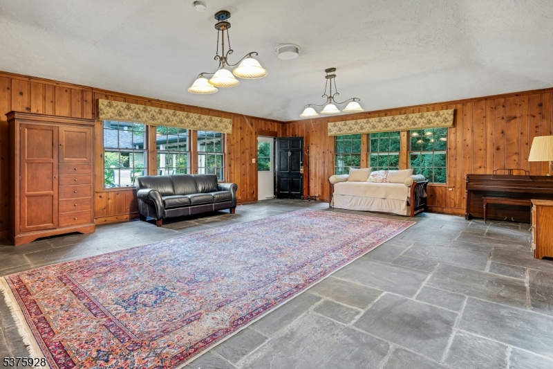 82 Winsor Place Glen Ridge, NJ 07028 - Photo 8 of 17 a living room with furniture and a large window