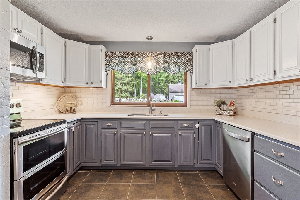 941 Doe Valley Road Athol, MA 01331 - Photo 8 of 42 a kitchen with a sink stove and microwave