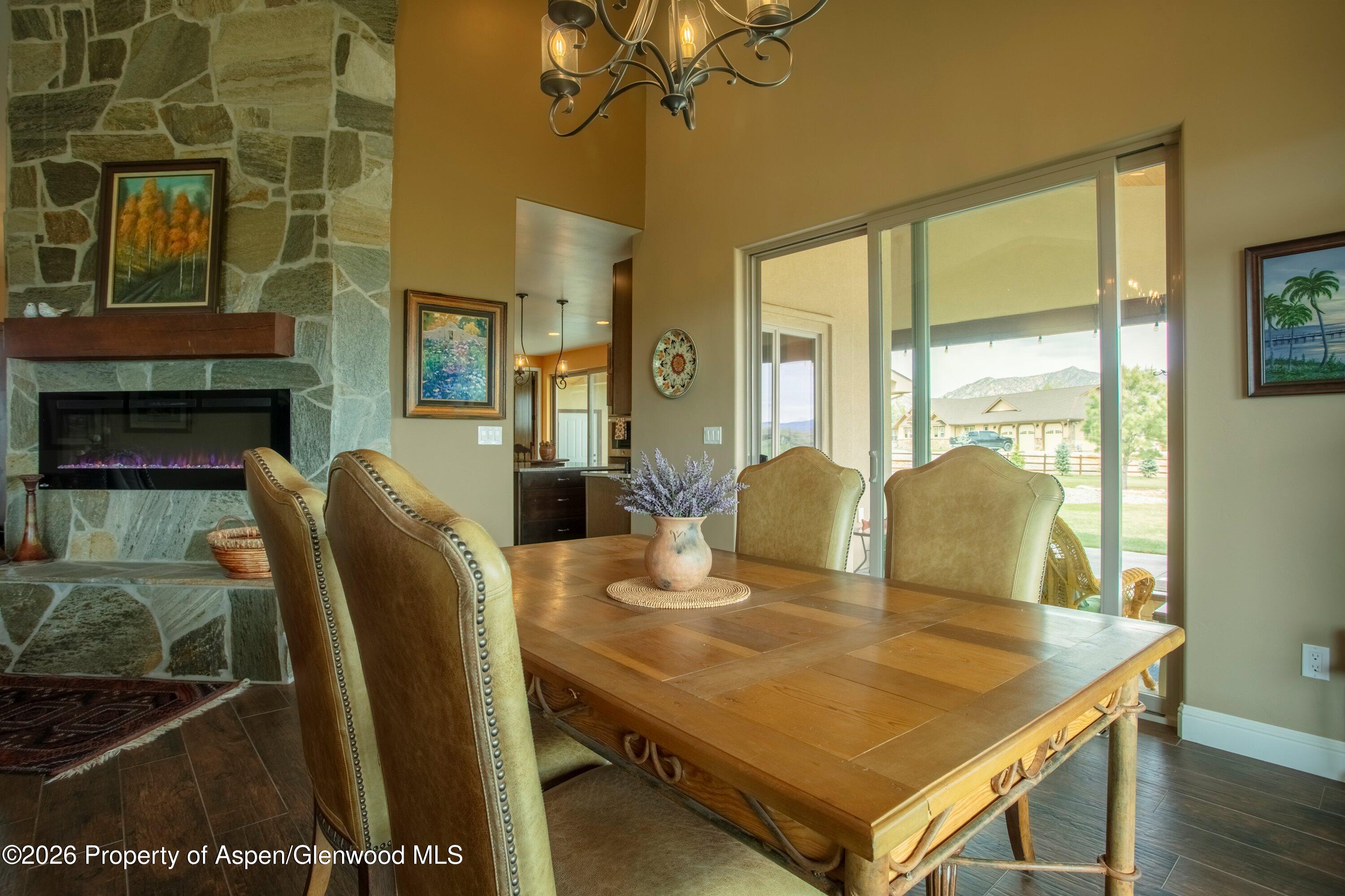 265 South Meadow Drive Rifle, CO 81650 - Photo 38 of 76 a view of a dining room with furniture and wooden floor