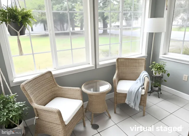 a view of a dining room with furniture and windows