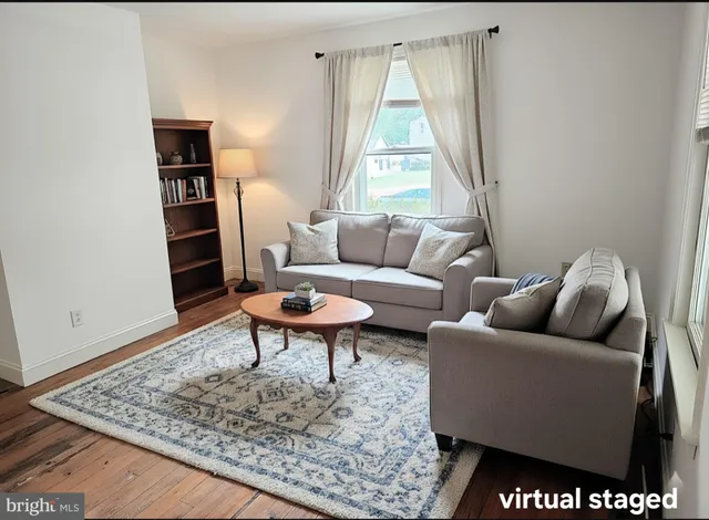 a living room with furniture and a rug
