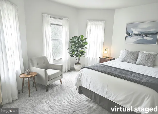 a bedroom with a bed and a couch