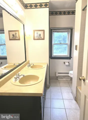 a view of an empty room and a window