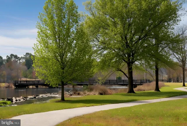 a view of a swimming pool with outdoor seating