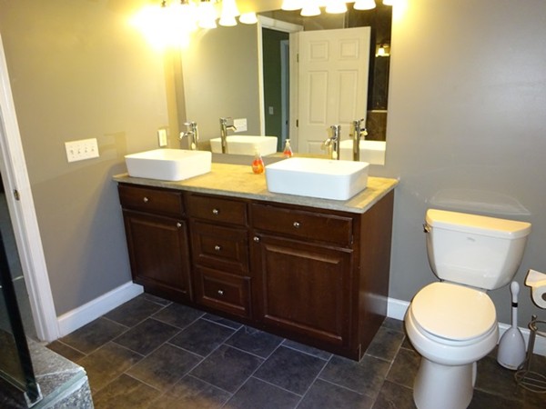 24 Gitchee Gummie Road Wareham, MA 02532 - Photo 20 of 30 a bathroom with a toilet sink and mirror