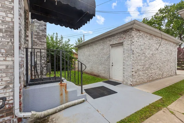 a backyard of a house with seating space