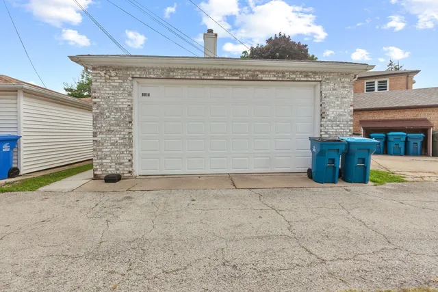 a view of a house with potted plants