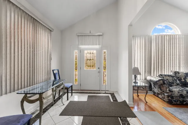 a view of a livingroom with furniture and staircase