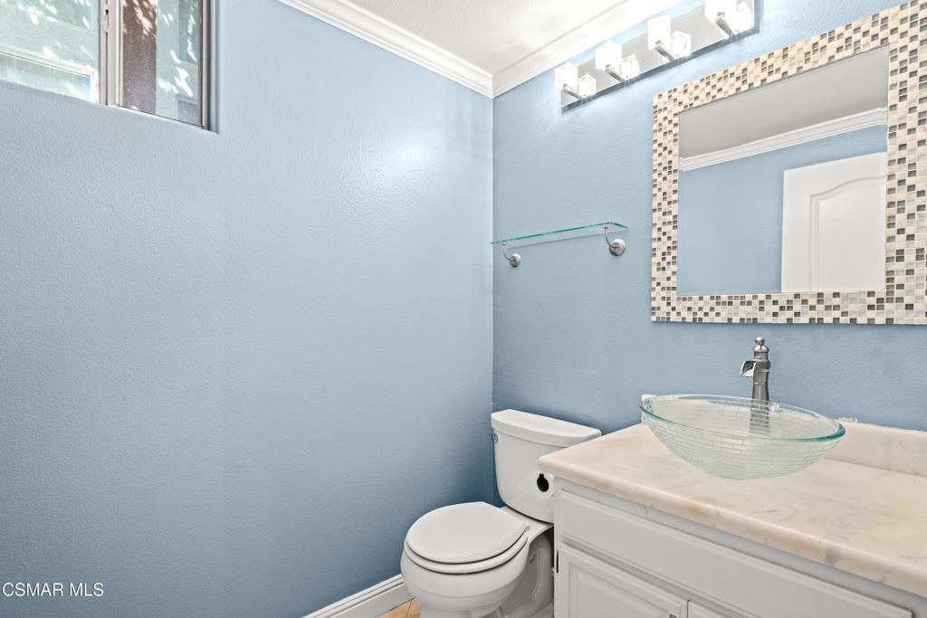 3881 Timberridge Road Moorpark, CA 93021 - Photo 13 of 28 a bathroom with a sink a toilet and mirror