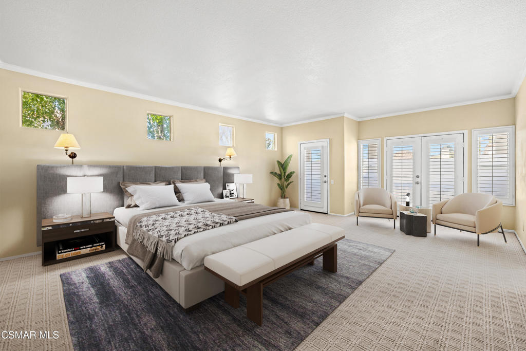 3881 Timberridge Road Moorpark, CA 93021 - Photo 14 of 28 a spacious bedroom with a bed a couch and large window