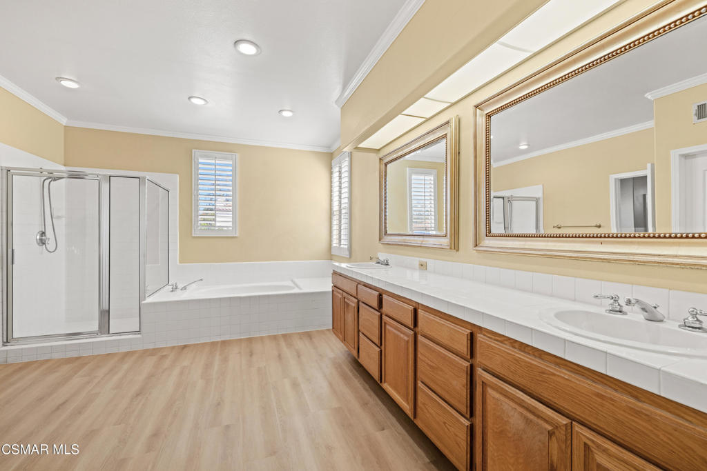 3881 Timberridge Road Moorpark, CA 93021 - Photo 17 of 28 a spacious bathroom with a large tub and sink