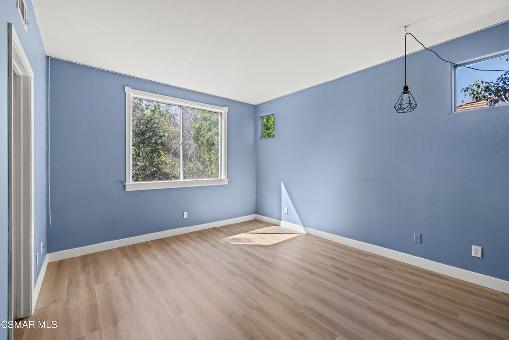 3881 Timberridge Road Moorpark, CA 93021 - Photo 21 of 28 a view of an empty room with window and wooden floor