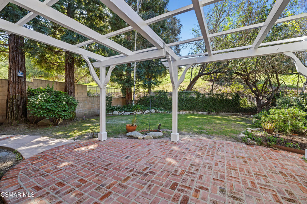 3881 Timberridge Road Moorpark, CA 93021 - Photo 26 of 28 a view of a house with backyard and porch