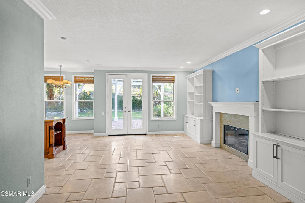 3881 Timberridge Road Moorpark, CA 93021 - Photo 7 of 28 a view of an empty room with a fireplace and a window