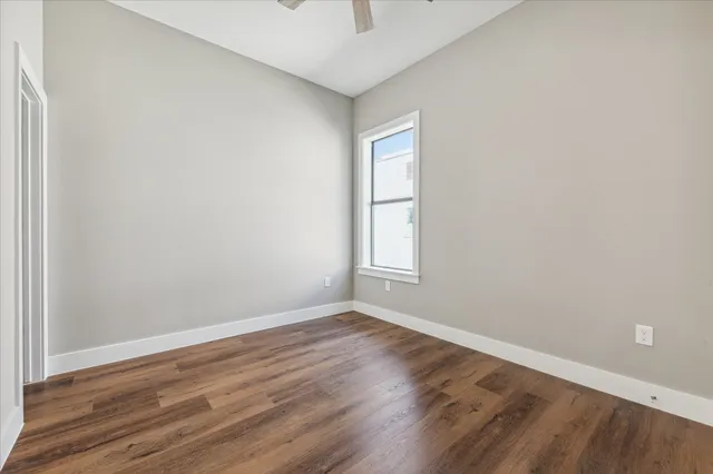 a view of walk in closet with empty racks