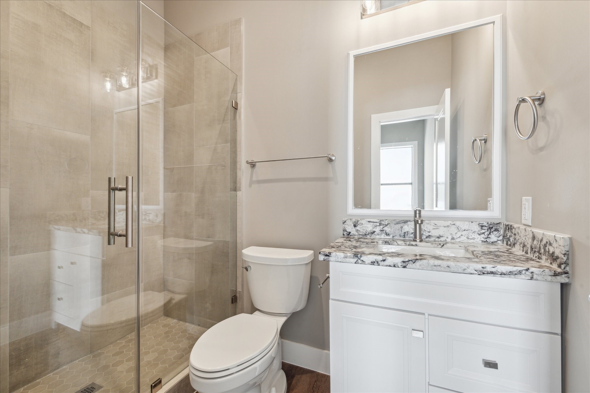 3102 Eunice Street Houston, TX 77009 - Photo 23 of 29 a bathroom with a granite countertop toilet sink and a mirror