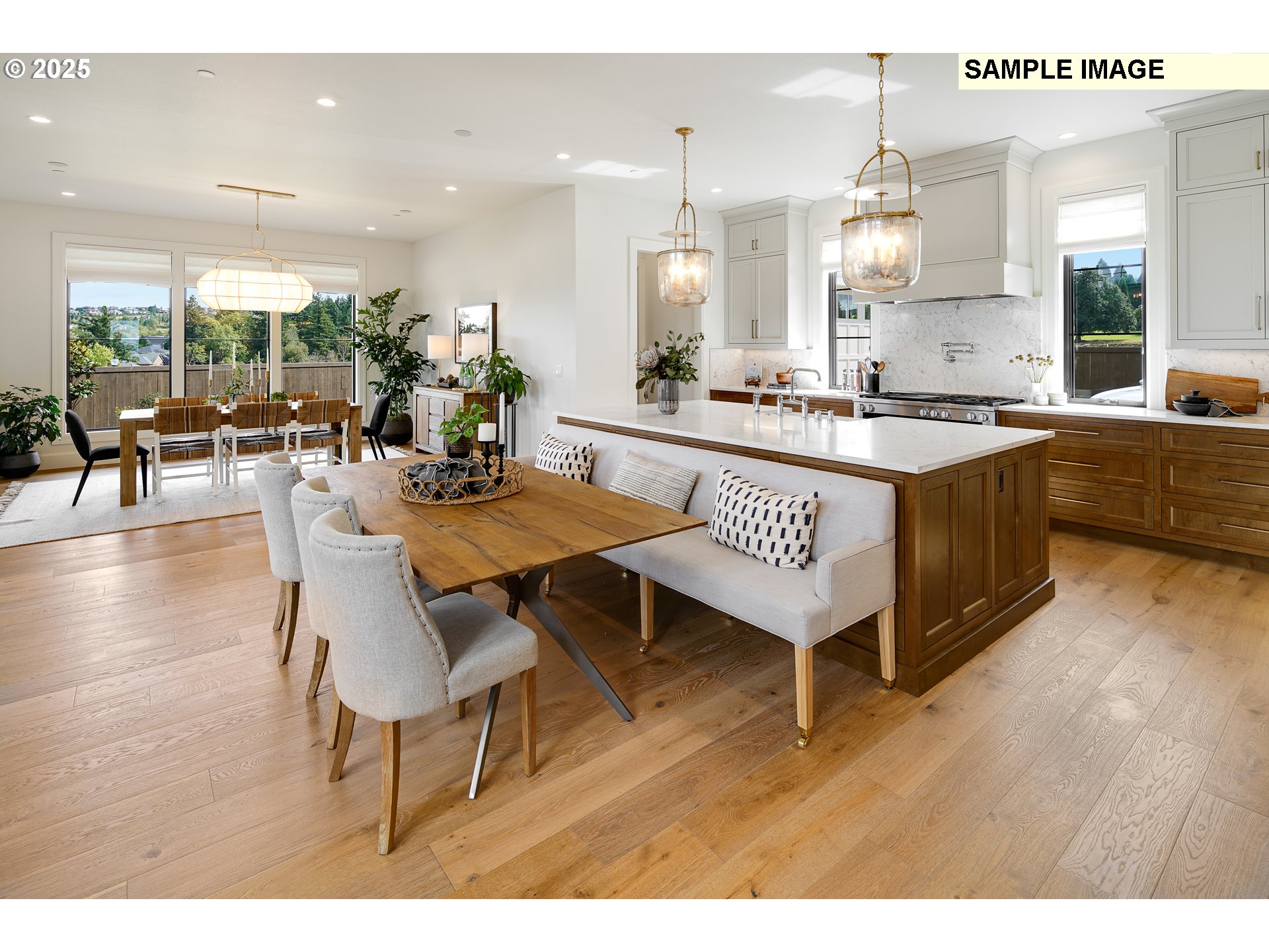 645 Northwest Halifax Street, Unit LOT 7 Camas, WA 98607 - Photo 9 of 13 a large kitchen with a table and chairs