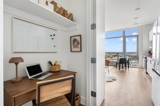 a workspace with furniture and chandelier