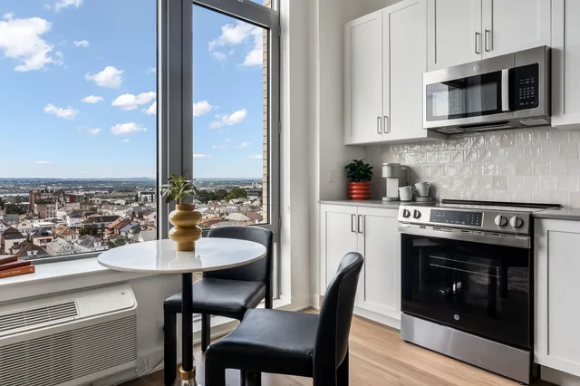 a kitchen with a stove and a microwave