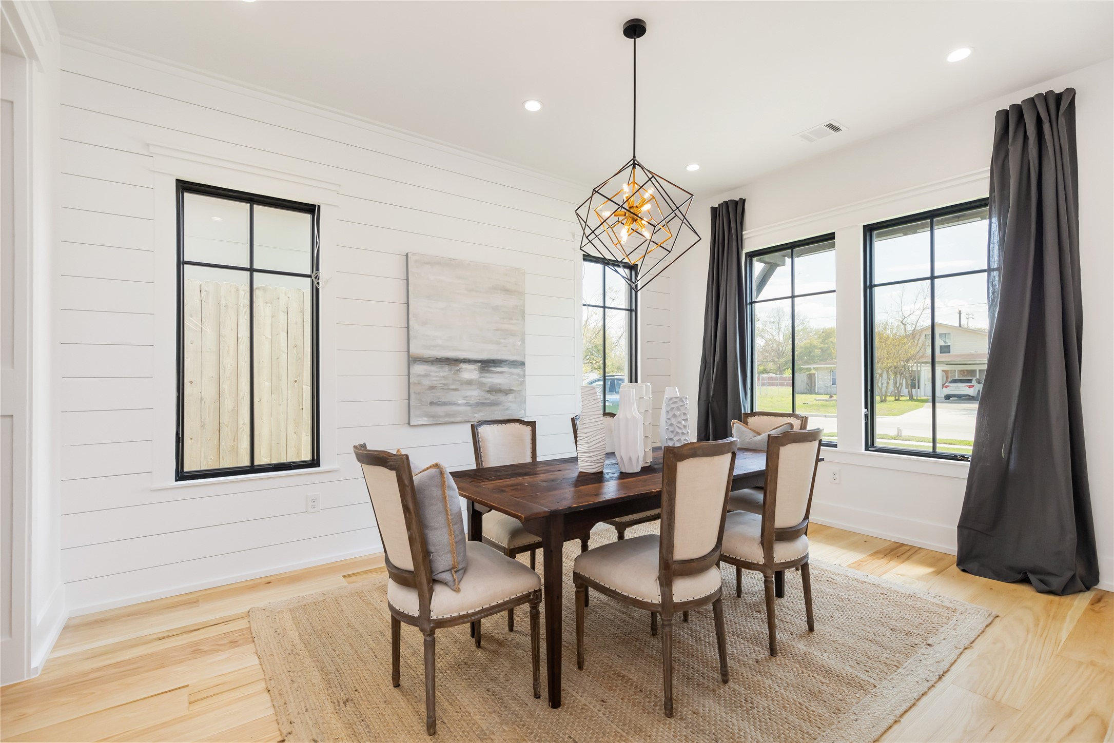 934 West 43rd Street Houston, TX 77018 - Photo 5 of 15 a view of a dining room with furniture wooden floor and chandelier