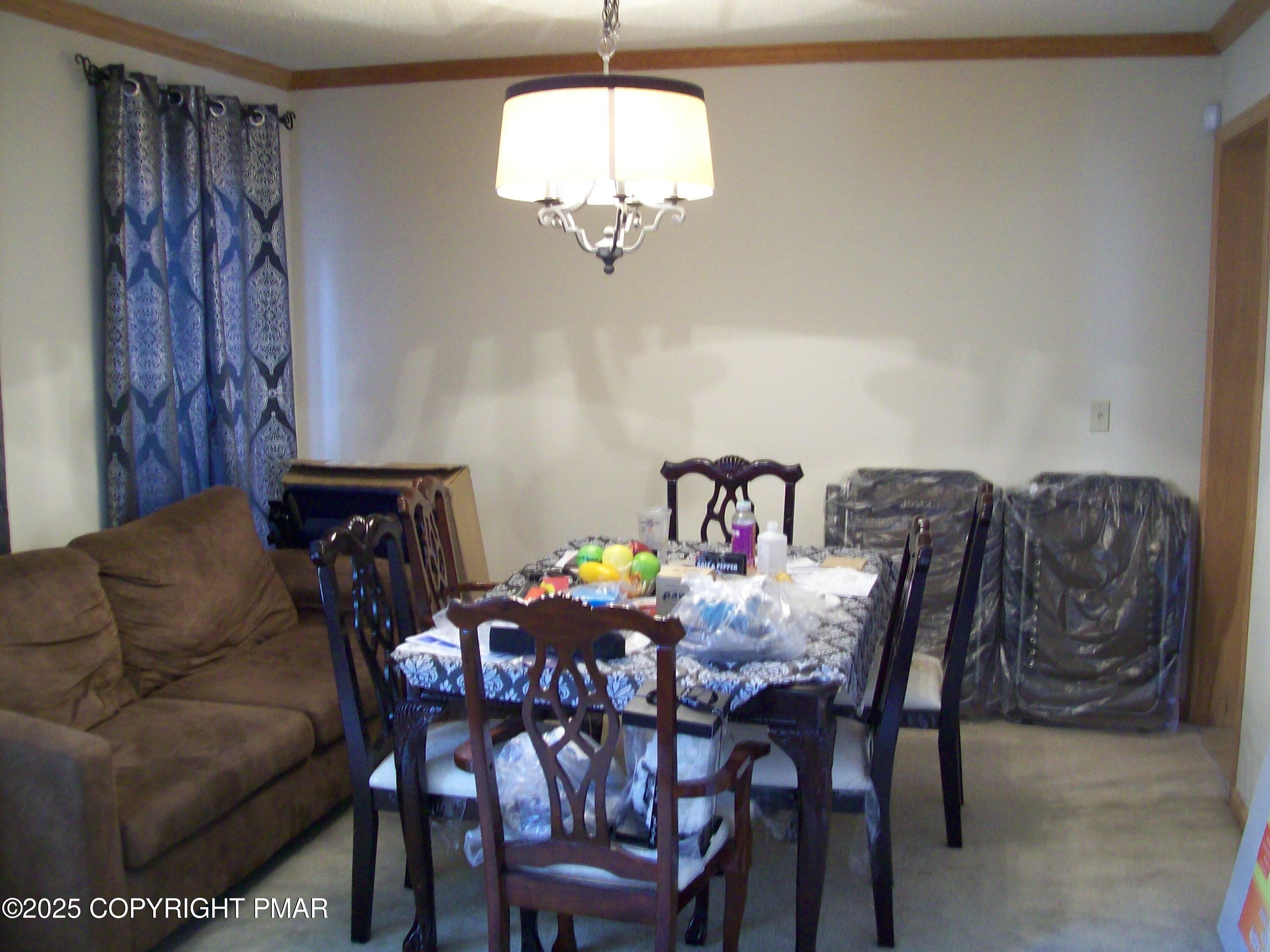 106 Bull Run Long Pond, PA 18334 - Photo 14 of 31 a view of a dining room with furniture and chandelier