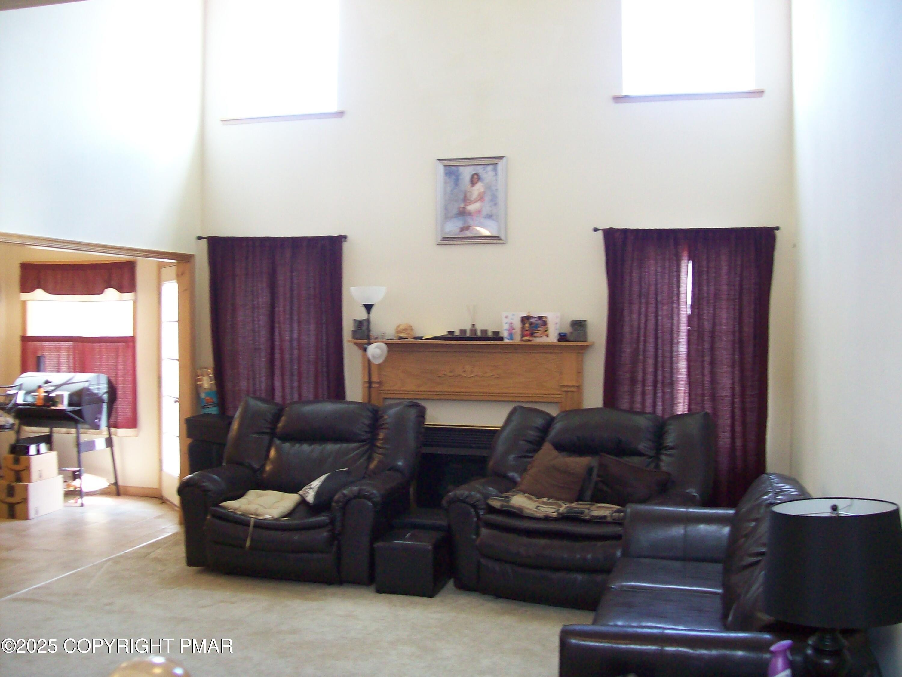 106 Bull Run Long Pond, PA 18334 - Photo 15 of 31 a living room with furniture a ceiling fan and a window