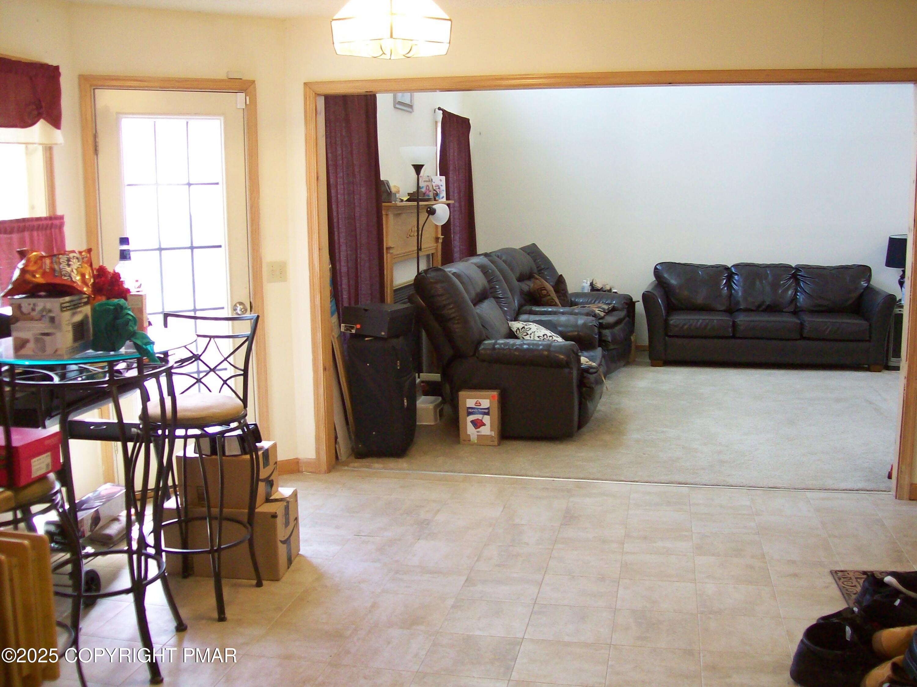 106 Bull Run Long Pond, PA 18334 - Photo 18 of 31 a living room with furniture a window and a flat screen tv