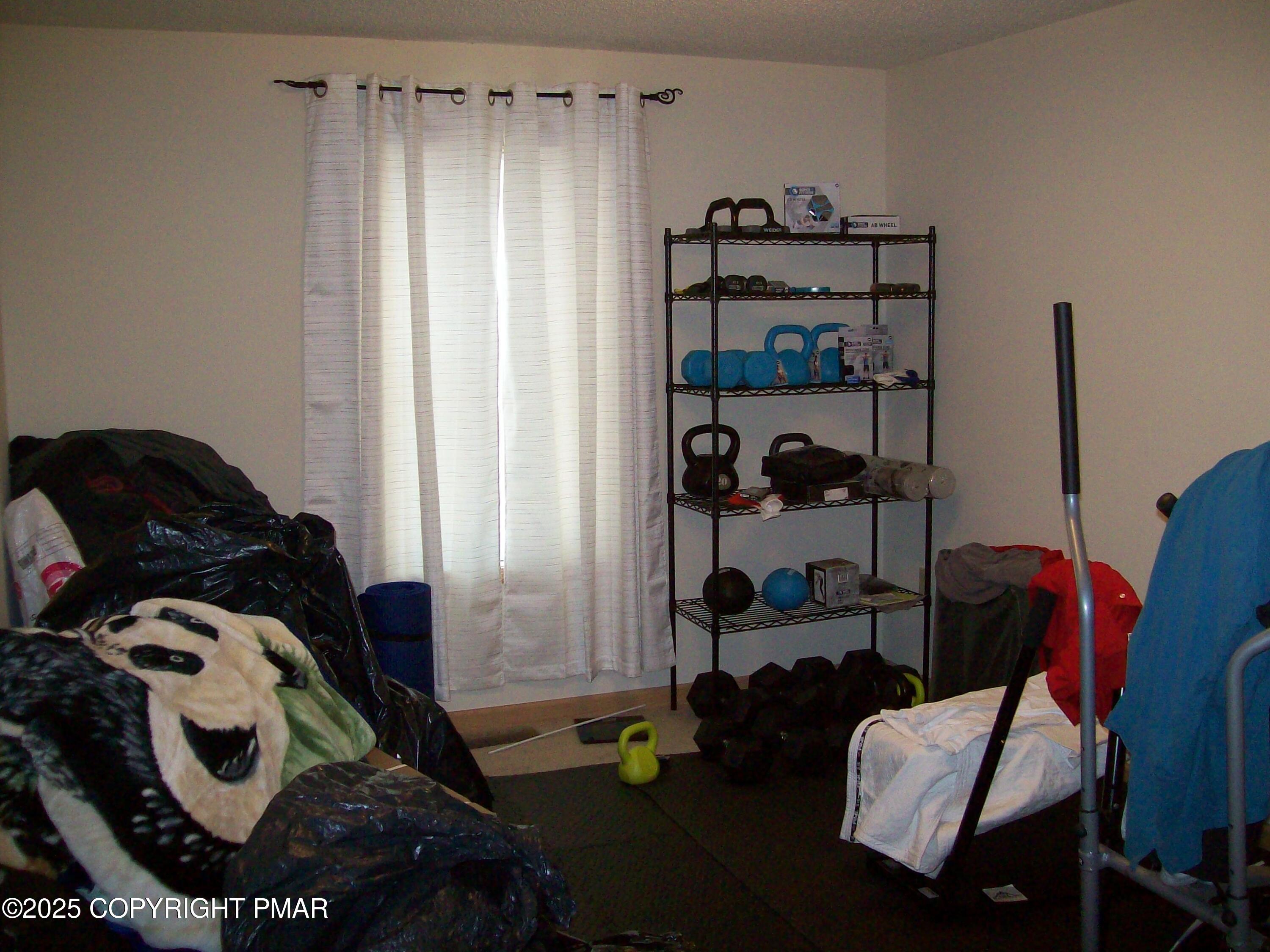 106 Bull Run Long Pond, PA 18334 - Photo 20 of 31 a bedroom with a bed and a chair