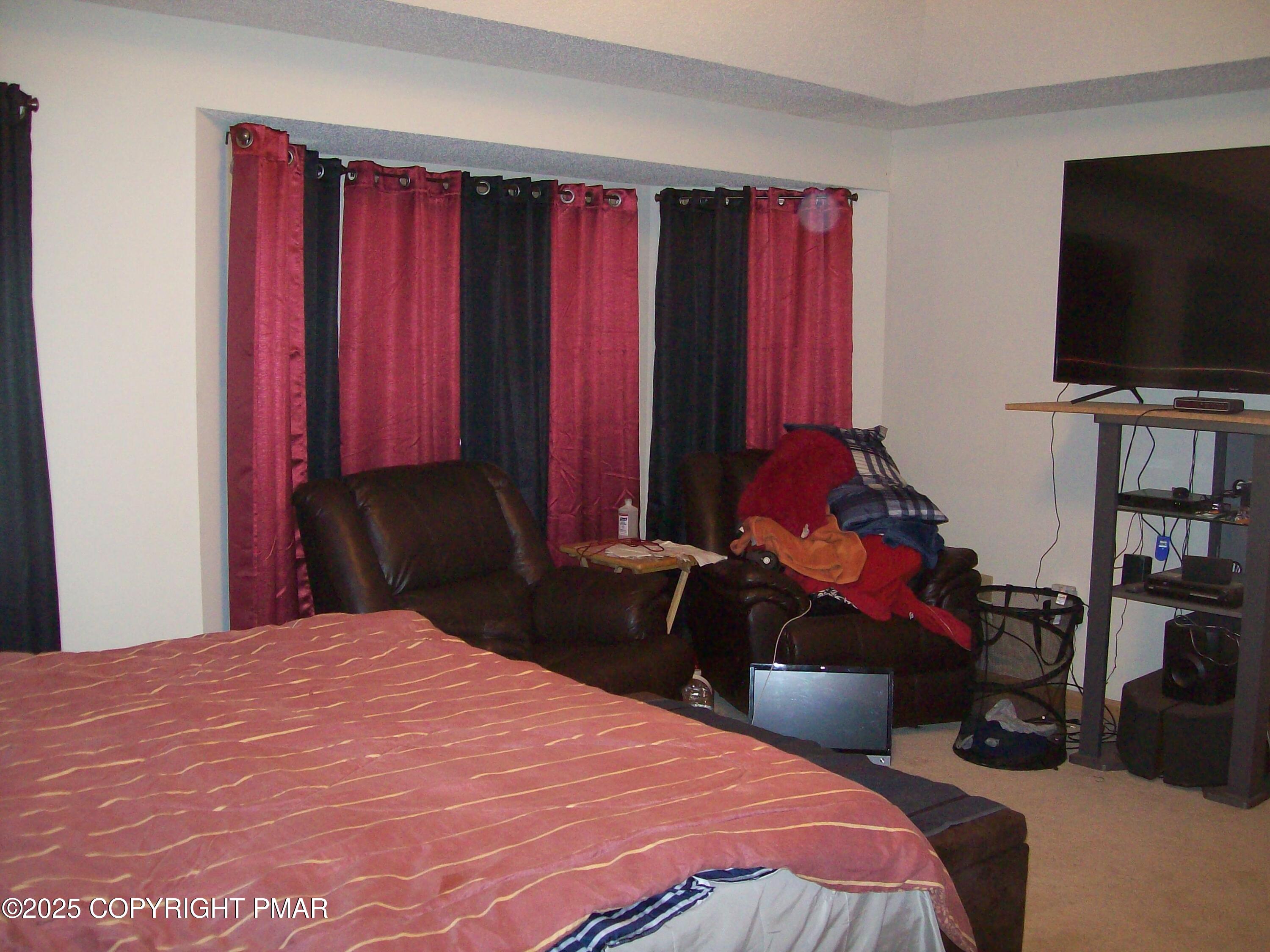 106 Bull Run Long Pond, PA 18334 - Photo 24 of 31 a bedroom with a bed and a flat screen tv