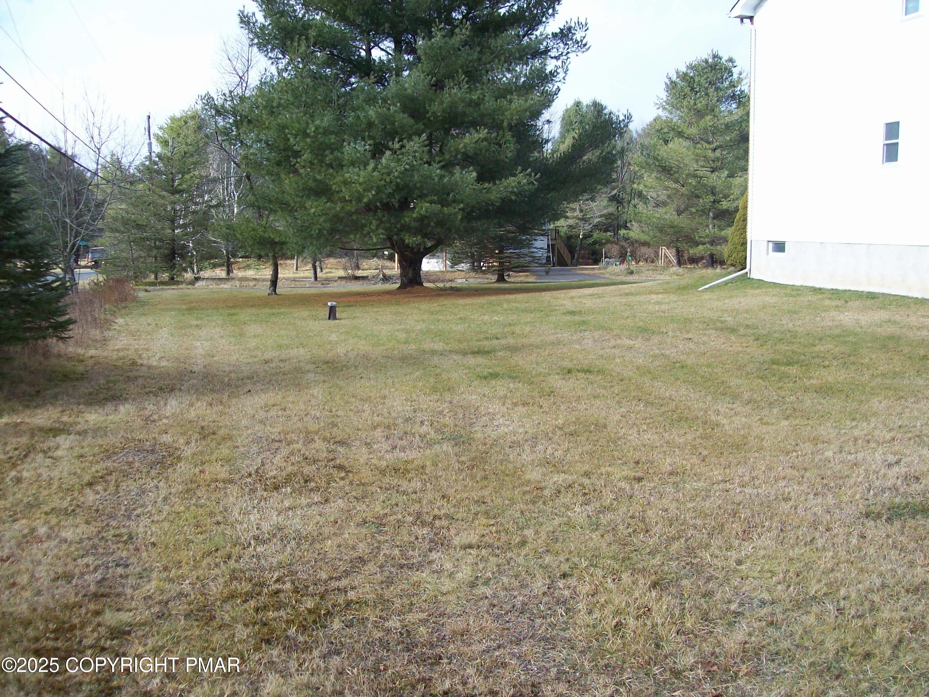 106 Bull Run Long Pond, PA 18334 - Photo 8 of 31 a view of outdoor space with trees all around