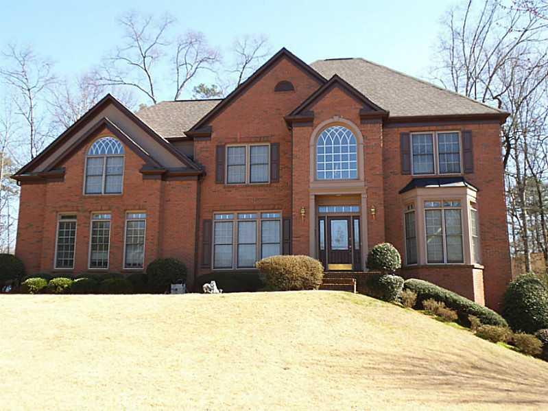 3795 Berkeley View Drive Berkeley Lake, GA 30096 - Photo 1 of 1 Exterior Front. 3 sided Brick, concrete sidings in rear of the house