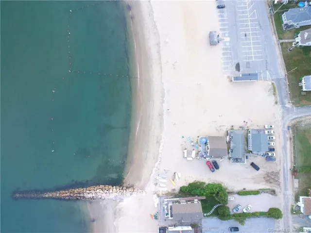 a bath room with a sink and a mirror