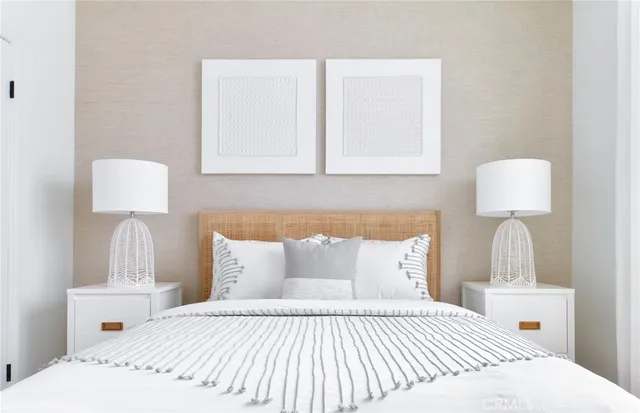 a bedroom with a bed and a lamp