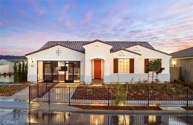 a front view of house with yard and outdoor seating