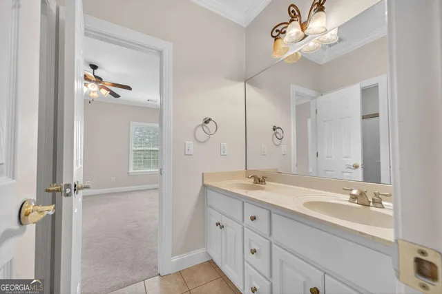 a bathroom with a granite countertop sink a mirror and a shower