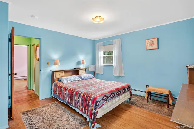 a bedroom with a bed and a table in it