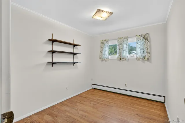 an empty room with a empty space and window