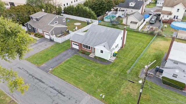 an aerial view of a house with a garden