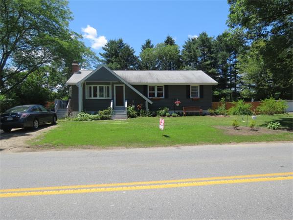 107 Lexington Road Billerica, MA 01821 - Photo 11 of 11 a view of a house with a swimming pool and a yard
