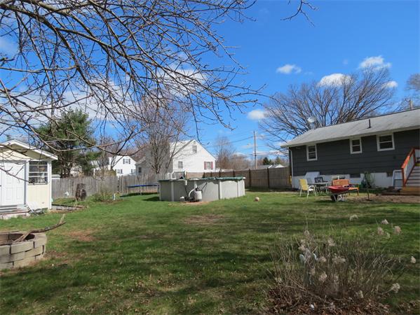 107 Lexington Road Billerica, MA 01821 - Photo 7 of 11 a view of a house with a yard and sitting area