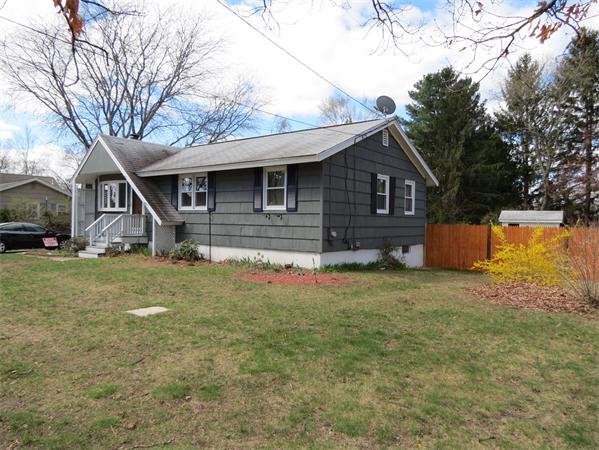 107 Lexington Road Billerica, MA 01821 - Photo 10 of 11 a front view of a house with a yard