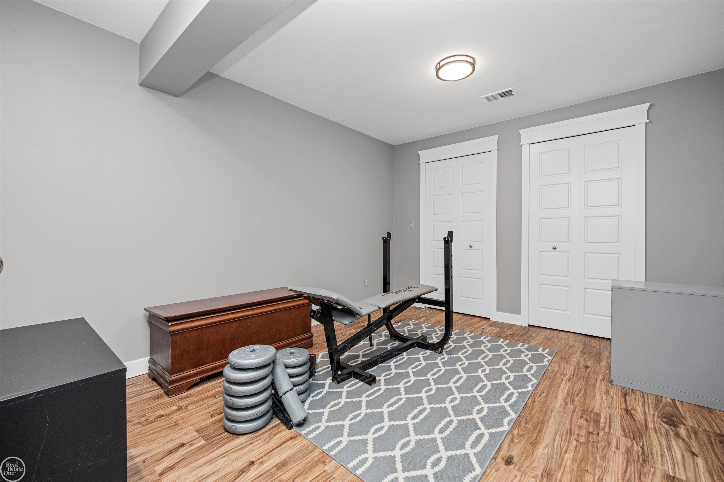 64110 Campground Road Washington, MI 48095 - Photo 65 of 74 Endless possibilities with three large bonus rooms. Perfect for guest rooms, home gym, sewing/craft room, and so much more!