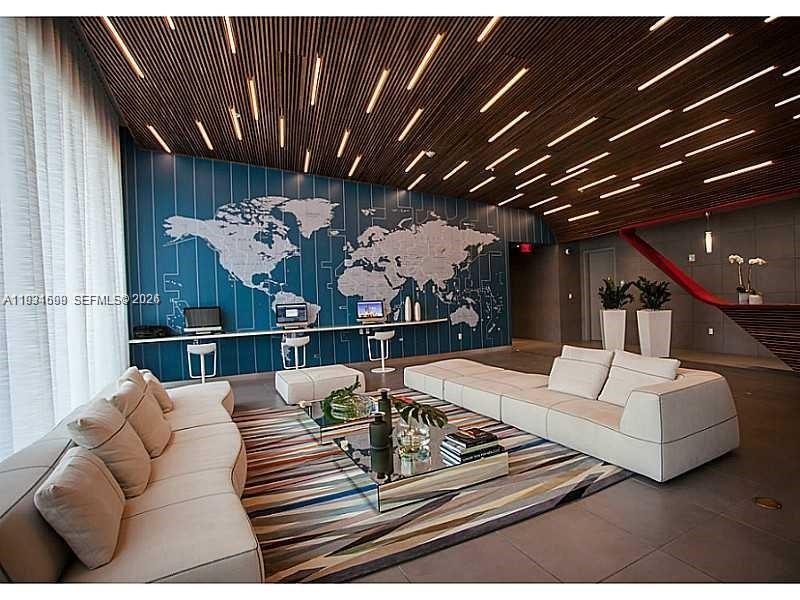 2602 East Hallandale Beach Boulevard, Unit R3010 Hallandale Beach, FL 33009 - Photo 10 of 10 a living room with furniture