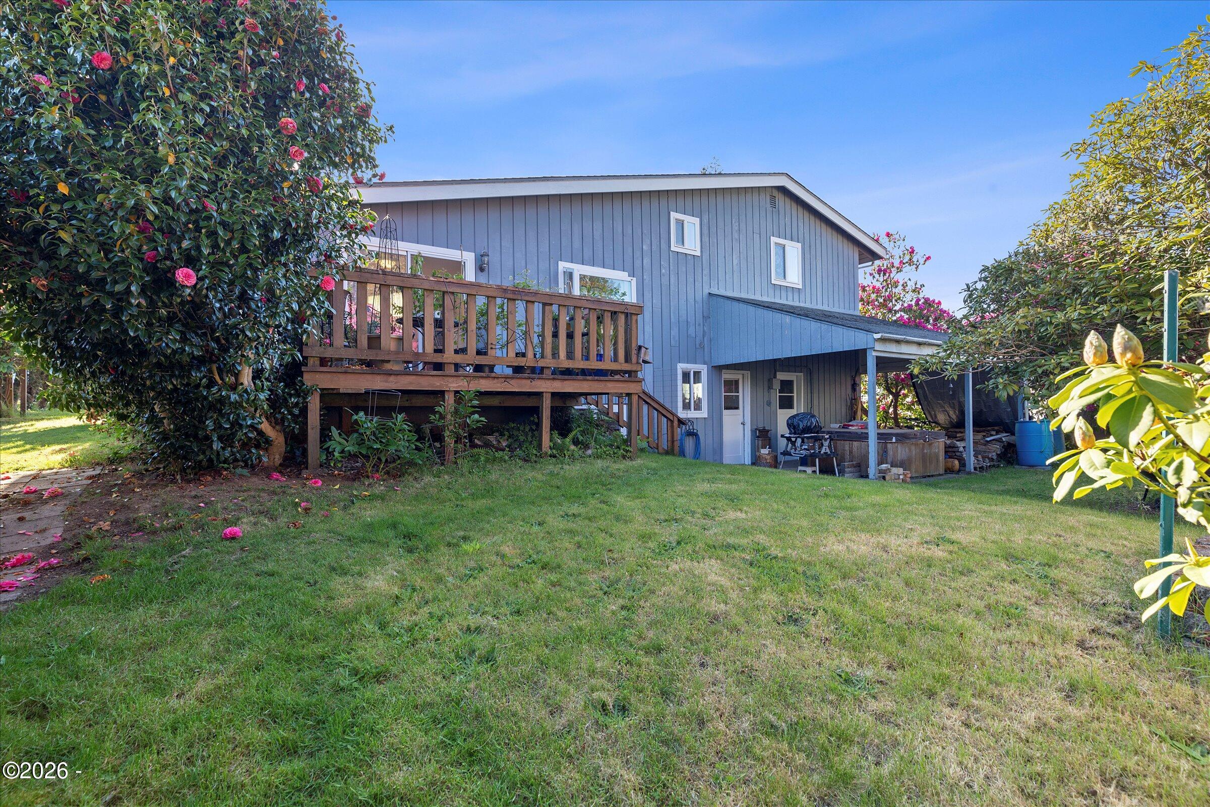 1318 Southeast Maple Street Toledo, OR 97391 - Photo 43 of 54 Backyard with covered patio