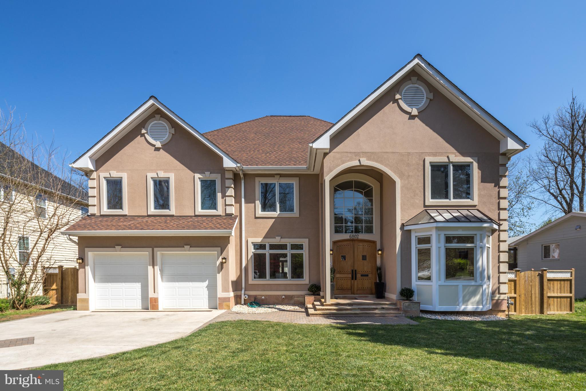 6802 Old Chesterbrook Road McLean, VA 22101 - Photo 2 of 30 a front view of a house with a yard